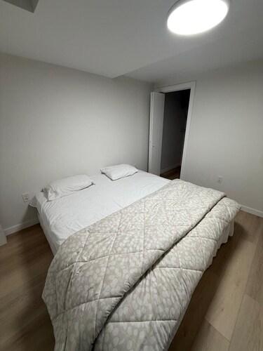 Cozy 1 bedroom basement suite with private entrance from the side of the house