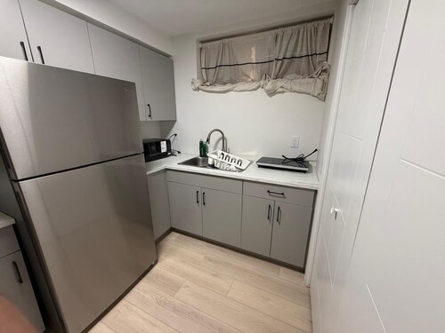Cozy 1 bedroom basement suite with private entrance from the side of the house