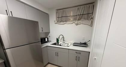 Cozy 1 bedroom basement suite with private entrance from the side of the house
