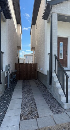 Cozy 1 bedroom basement suite with private entrance from the side of the house