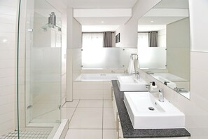 Bathroom - 2-bedroom smart-styled apartment in welcoming Sandton with AC for comfort (Sandton)