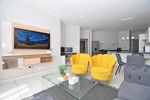 Living area - 2-bedroom smart-styled apartment in welcoming Sandton with AC for comfort (Sandton)