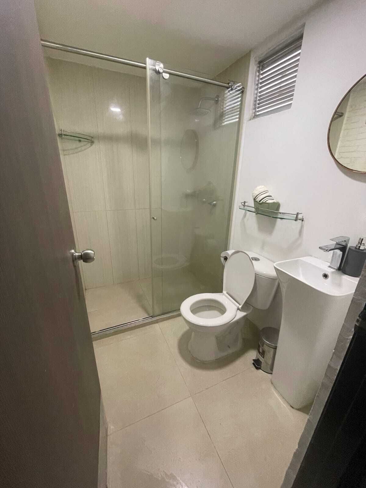 Shower, towels, soap, toilet paper