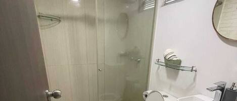 Shower, towels, soap, toilet paper