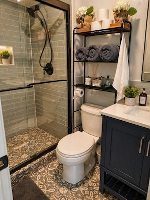 Shower, hair dryer, towels, soap