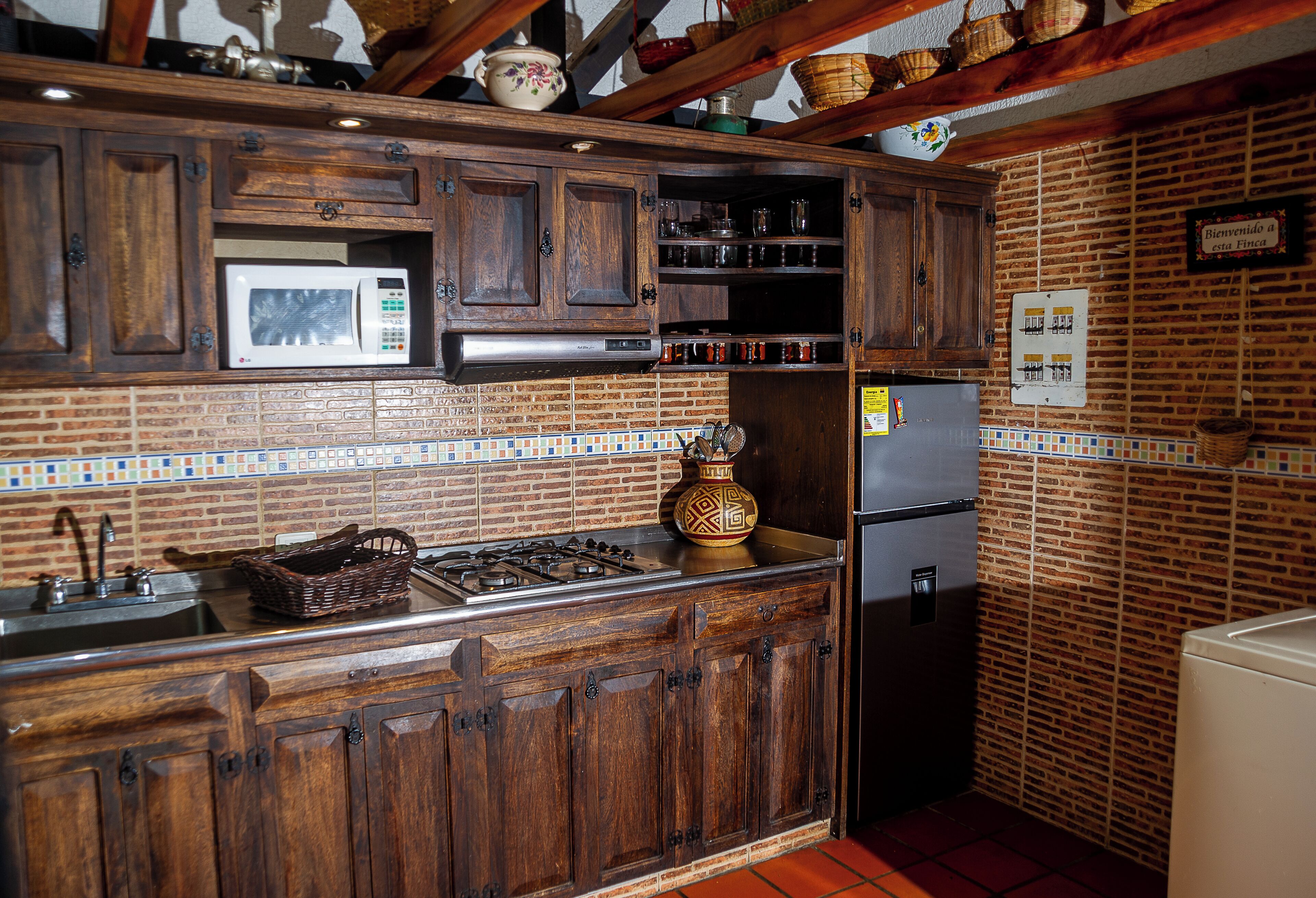 Fridge, microwave, coffee/tea maker, cookware/dishes/utensils