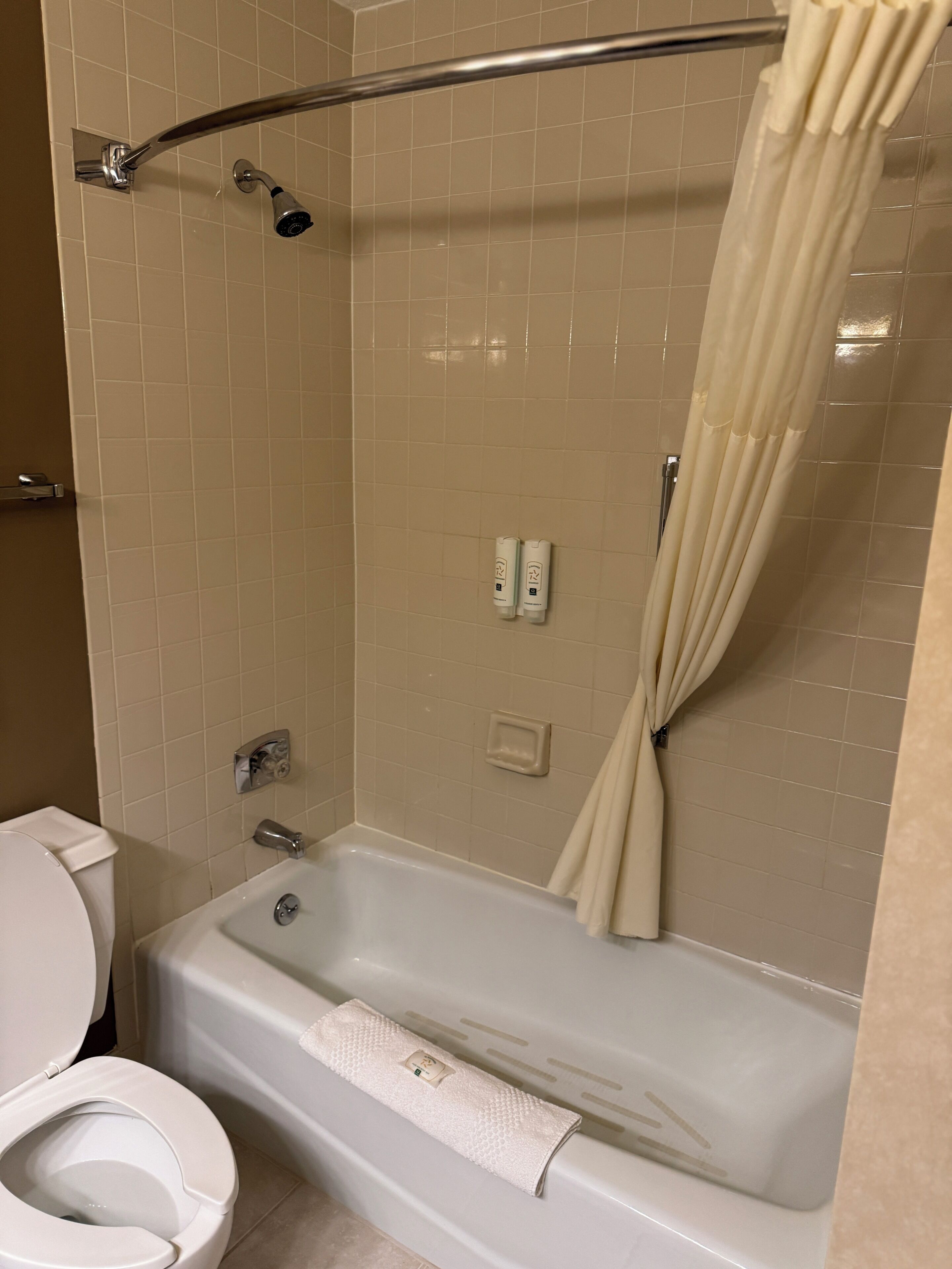 Bathtub, hair dryer, towels, soap