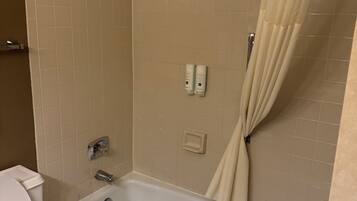 Bathtub, hair dryer, towels, soap