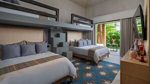A hotel room with two beds, a bunk bed, a desk, and a view of greenery outside. - Casa De Elementos in Punta Mita (Punta de Mita)