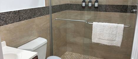 Shower, hair dryer, towels, soap