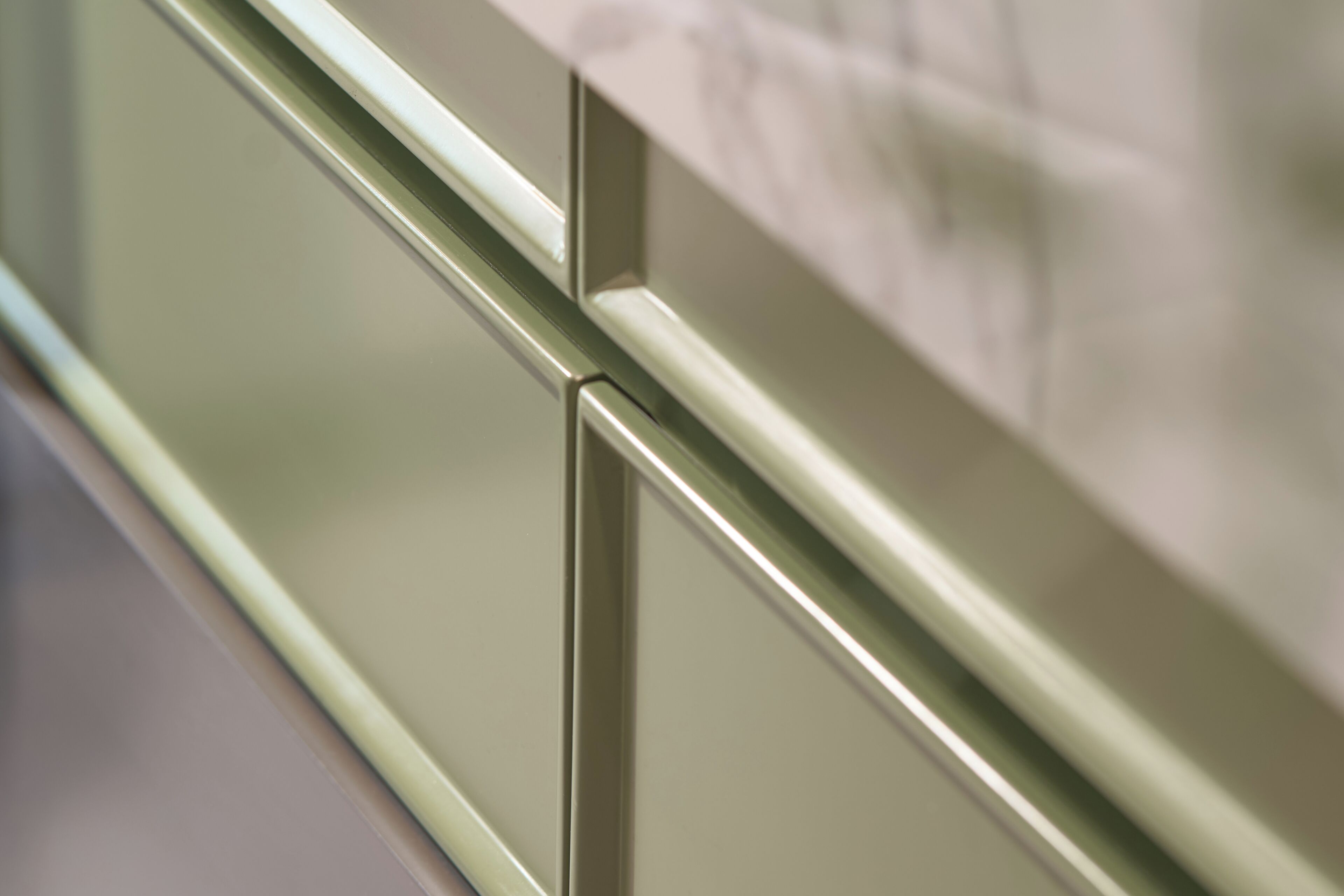 A close-up of a metallic handle on a door.
