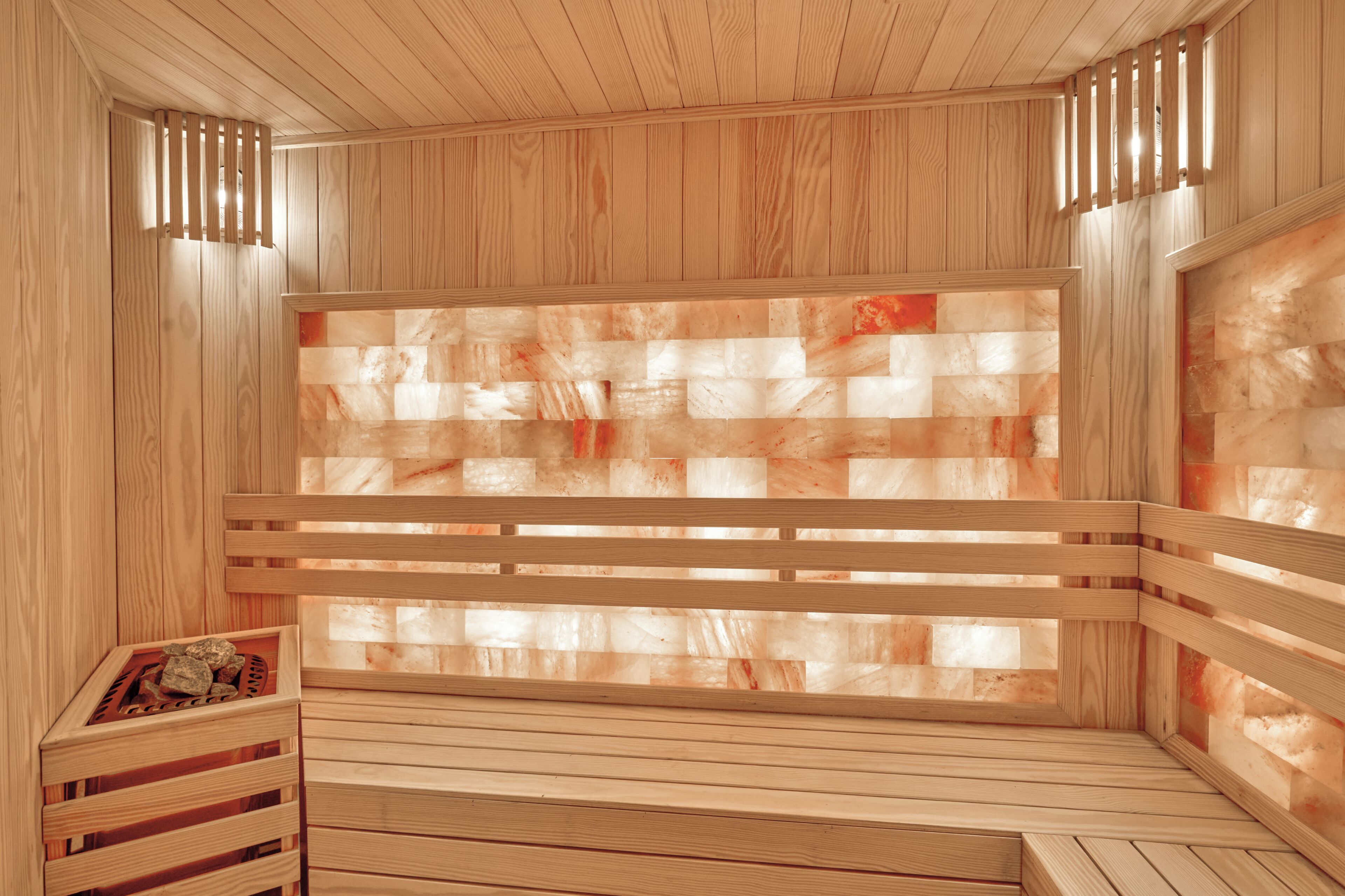 A sauna with wooden walls and benches.