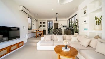Luxury Villa, 1 King Bed, Pool View | Living room | 55-inch TV with cable channels