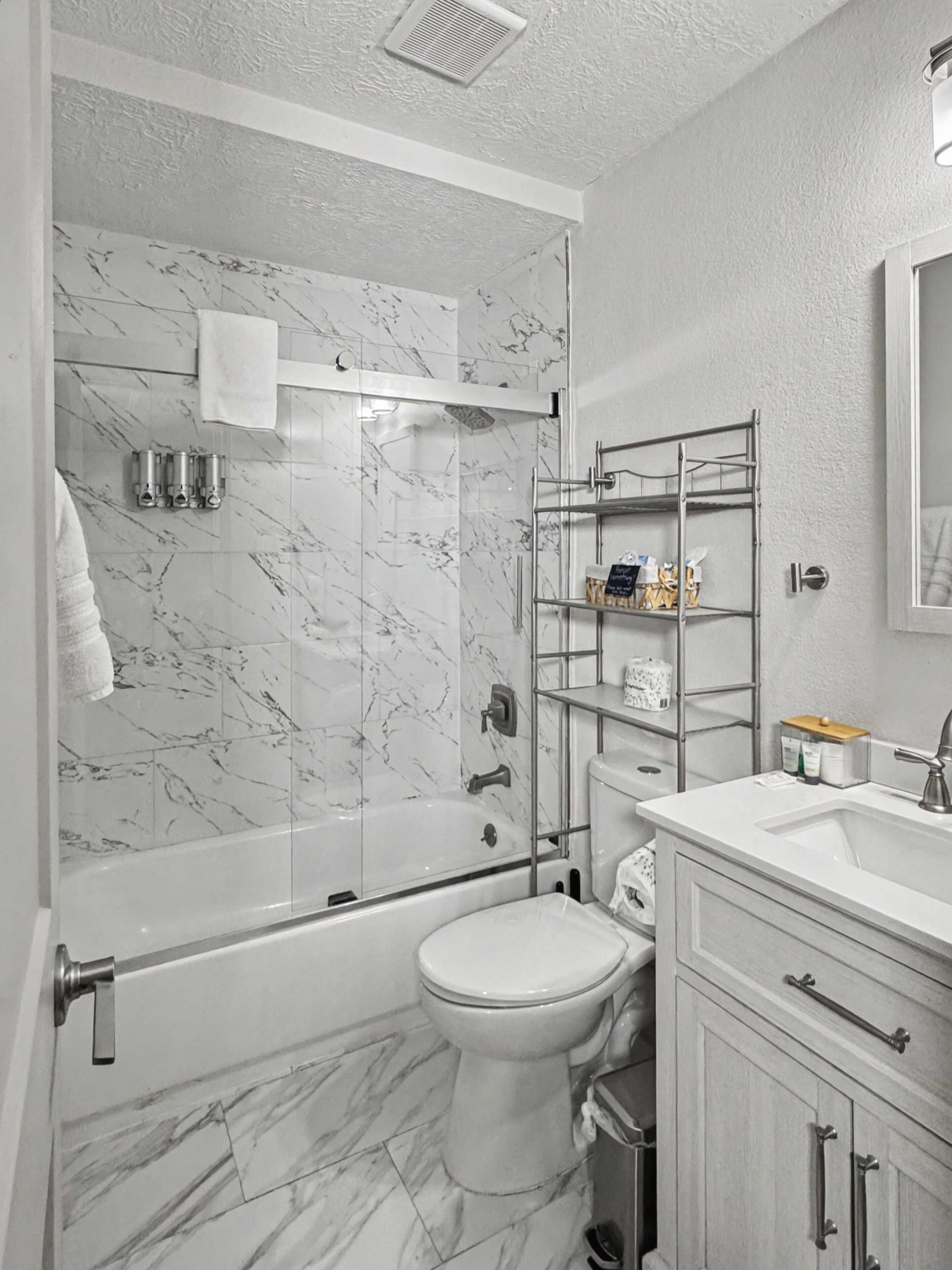 Shower, hair dryer, towels, shampoo