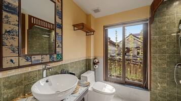 Shower, hair dryer, slippers, towels