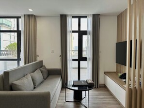 Premier Apartment, Balcony, City View | Living area - GEM Hotel & Residence (Hanoi)