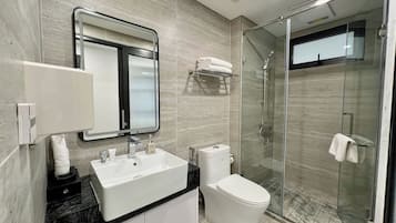 Executive Apartment, Balcony, City View | Bathroom | Shower, hair dryer, slippers, towels