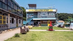 A two-story building with a sign reading 'YELLOW STOP pension'. - Yangyang Yellowstop Pet-friendly Pension (Yangyang)