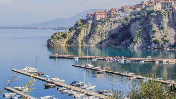 A coastal town with a marina, boats docked, and buildings on a hillside. - Beautiful home in Agropoli (Agropoli)