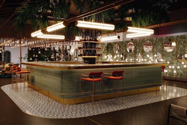 A bar area with a curved counter, hanging lights, and a patterned floor. - Movida Stay - Bui Vien Walking Street, District 1 (Thanh Pho Ho Chi Minh)