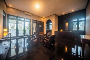 A hotel lobby with a reception desk, seating area, and large windows. - 3BR Private Pool Tatiya Villa-Nusa Dua (Nusa Dua)