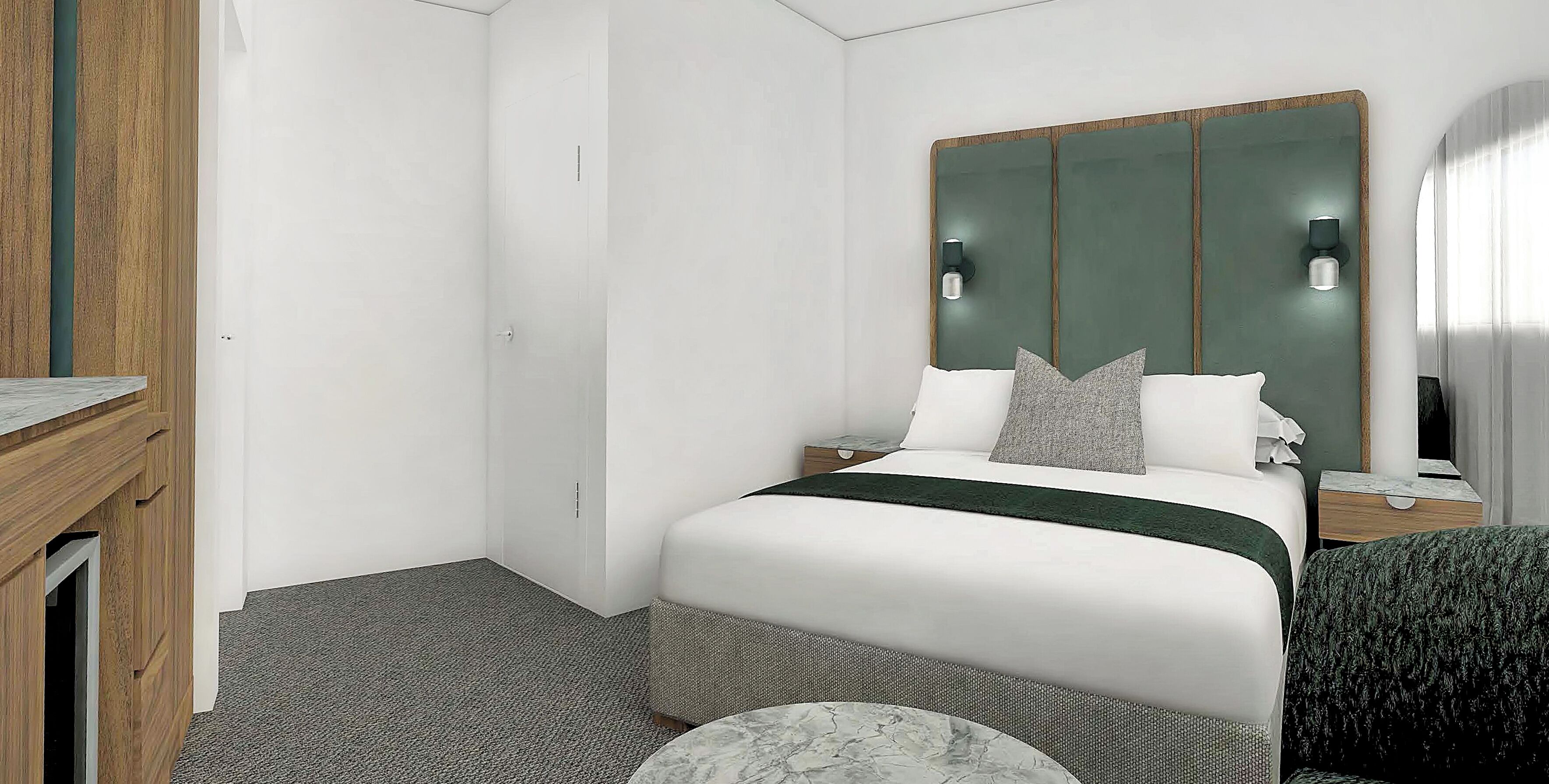 A hotel room with a bed, bedside tables, a desk, and a mirror.