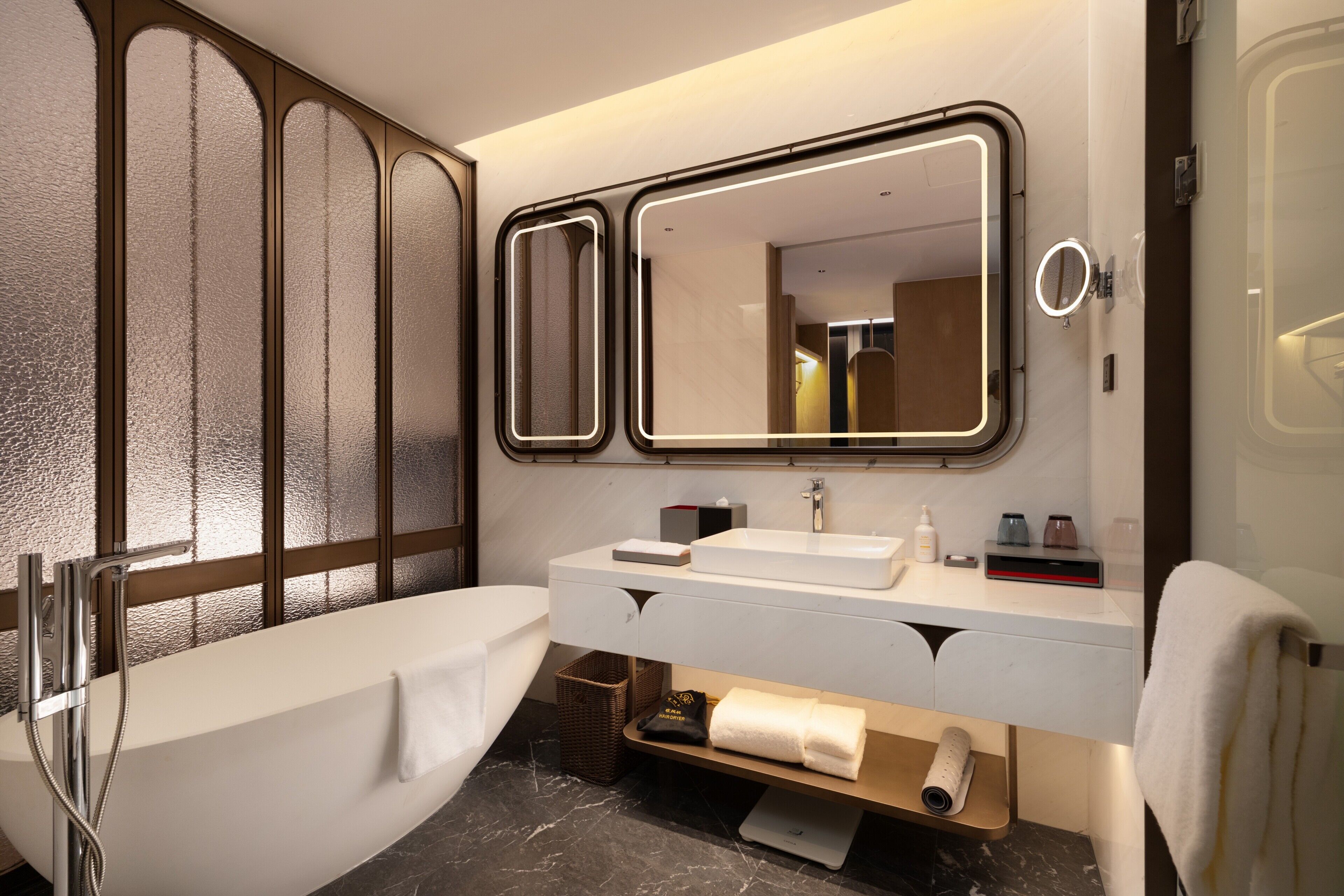 Separate bathtub and shower, free toiletries, hair dryer, slippers