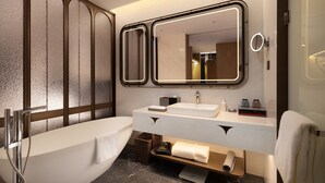 A modern bathroom with a freestanding bathtub, a large mirror with integrated lighting, a white vanity with a sink, and a towel rack. - ChangZhou DaJiuDian (Changzhou)
