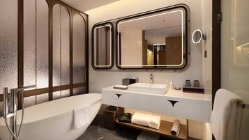 Separate bathtub and shower, free toiletries, hair dryer, slippers