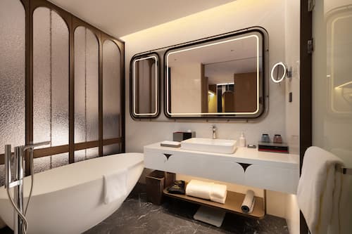 Separate bathtub and shower, free toiletries, hair dryer, slippers
