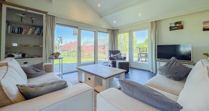 Detached house with garden by the water