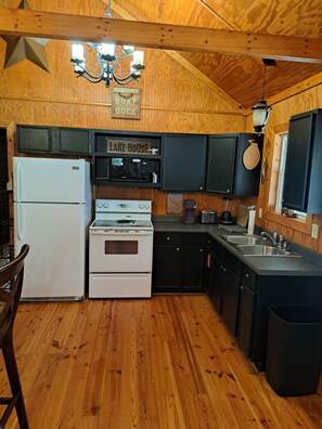 Fridge, microwave, oven, stovetop - Lake Life Cove - Quaint 3-bedroom 1-bath house with dock, private ramp, deck (Wedowee)