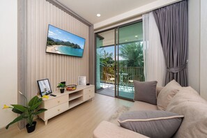 Double Room, Balcony, Garden View | Living area | 55-inch Smart TV with digital channels - Ozone Calista 1BR Suite Laguna Bang Tao (Choeng Thale)