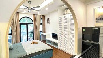 Desk, laptop workspace, blackout curtains, iron/ironing board