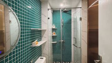 Shower, hair dryer, slippers, towels