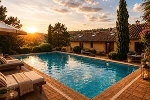 A swimming pool with lounge chairs, a patio area, and a building with a tiled roof. - Privat guest room in family villa in nature close to Madrid (Las Rozas de Madrid)