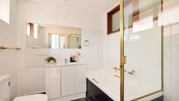 Shower, hair dryer, towels, shampoo