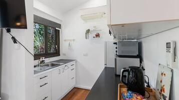 Fridge, microwave, oven, cookware/dishes/utensils