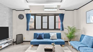 Comfort Apartment, 3 Bedrooms, Non Smoking, City View | Living area | 60-inch LCD TV with cable channels, Netflix, pay movies