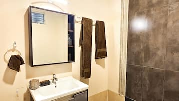 Shower, hair dryer, towels, soap