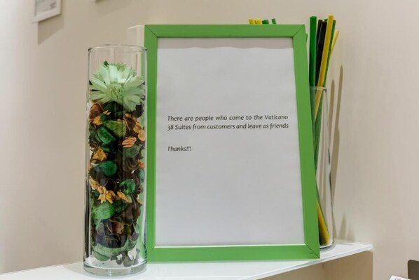 A framed message board with a message about the hotel's guests.