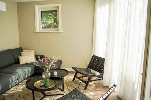 Luxury Nature Villa for 2 guests with elevated terrace and covered hot tub beneath the villa.