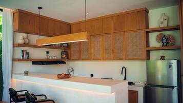 Full-sized fridge, dishwasher, espresso maker, coffee/tea maker