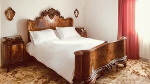 A wooden four-poster bed with white linens, two nightstands, and a patterned carpet. - Amazing home in Manciano with private swimming pool, can be inside or outside (Manciano)