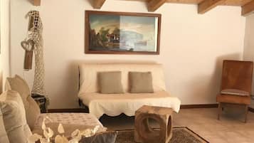 Apartamento família, sacada, vista para a montanha | Área de estar