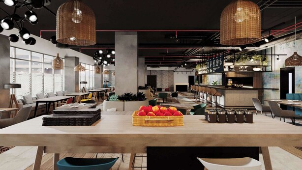 A modern restaurant with a central wooden table, wicker pendant lights, and a bar area with stools. - Ibis Lagos Lekki (Lekki)