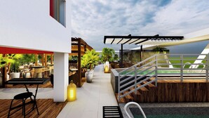 A modern outdoor area with a pool, seating, and a covered patio. - Ibis Lagos Lekki (Lekki)