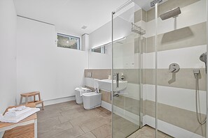 A modern bathroom with a glass shower enclosure, a sink, and a toilet. - Villa Alessia - 4 bed Villa With Lake Maggiore View (Stresa)