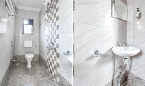 Deluxe Room | Bathroom | Shower, rainfall showerhead, free toiletries, towels - Via Galaxy Apartments (Pune)