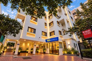 A hotel with a modern facade, a signboard for 'fab hotels', and a sign indicating 'My Galaxy AC rooms available'. - FabHotel Galaxy Apartment (Pune)